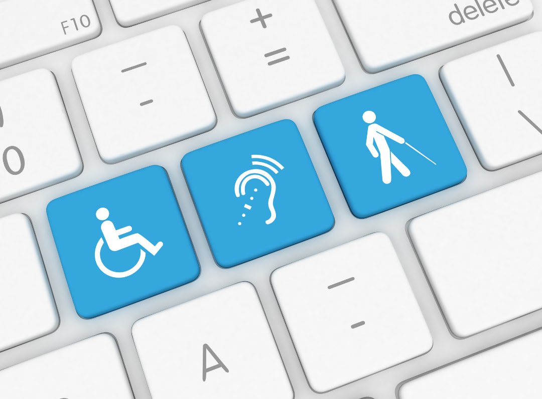 tastiera computer con tre tasti evidenziati che rappresentano alcune forme di disabilità